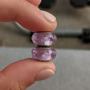 Two purple Murano glass charms